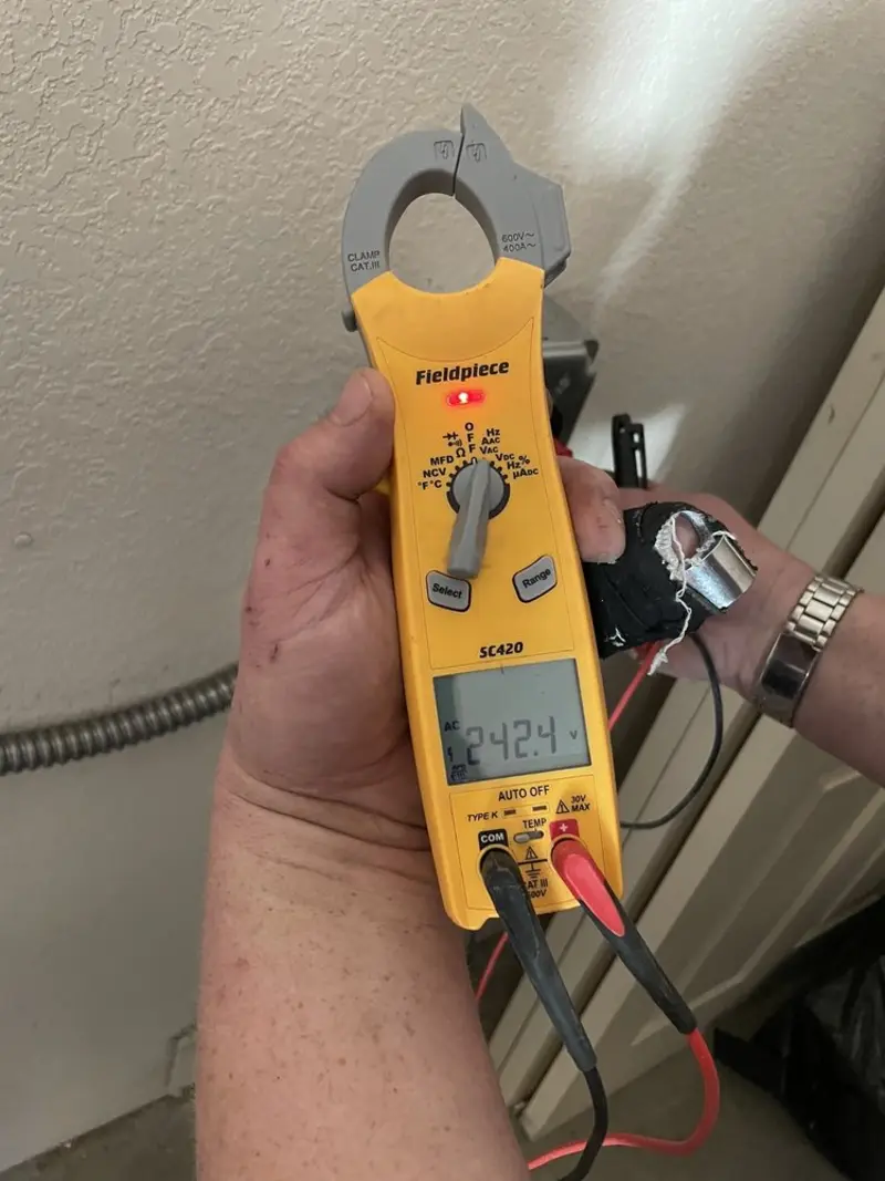 Voltage testing with clamp meter during Whole House Surge Protector in Greene